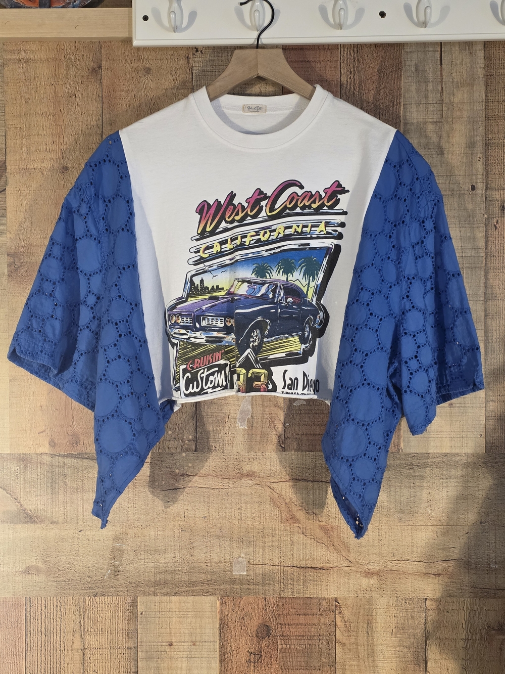 Upcycled West Coast Graphic Crop Top with Blue Eyelet Sleeves